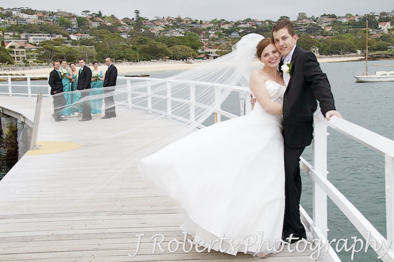 Bridal couple with fly away veil at balmoral baths - wedding photography sydney